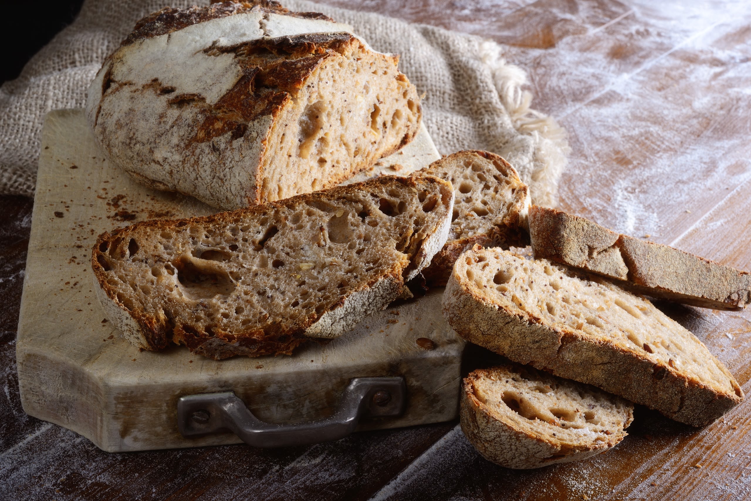 Sourdough bread sliced on a bread board