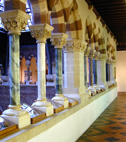 Pillars of Irish limestones and ophicalcites along the upper north gallery of the Museum Court.